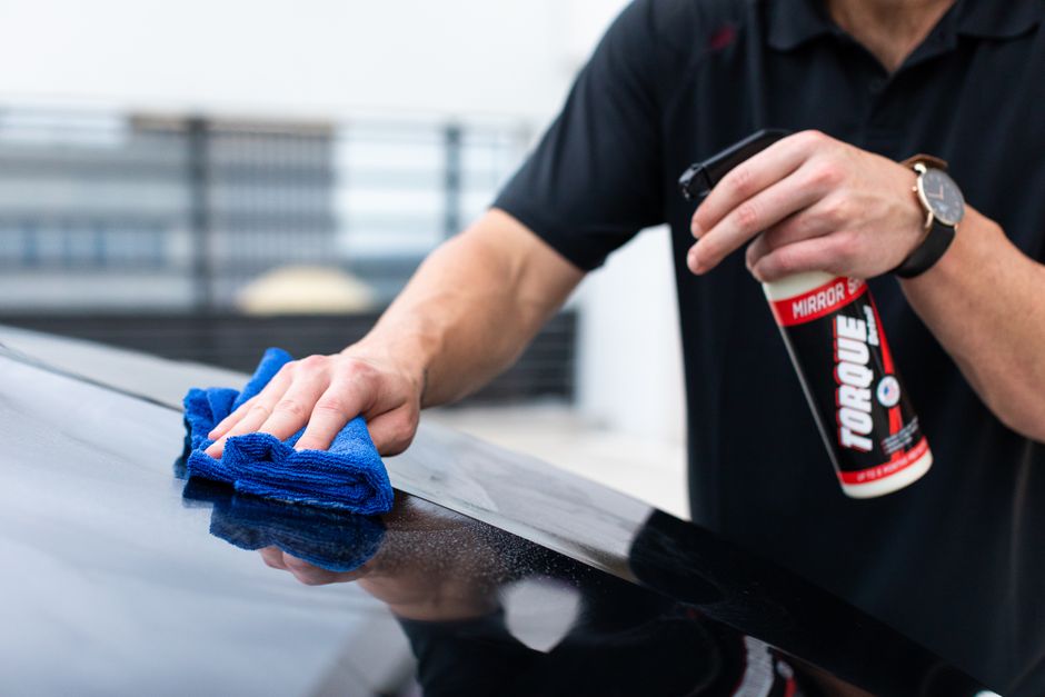 Drying car exterior with a microfiber towel