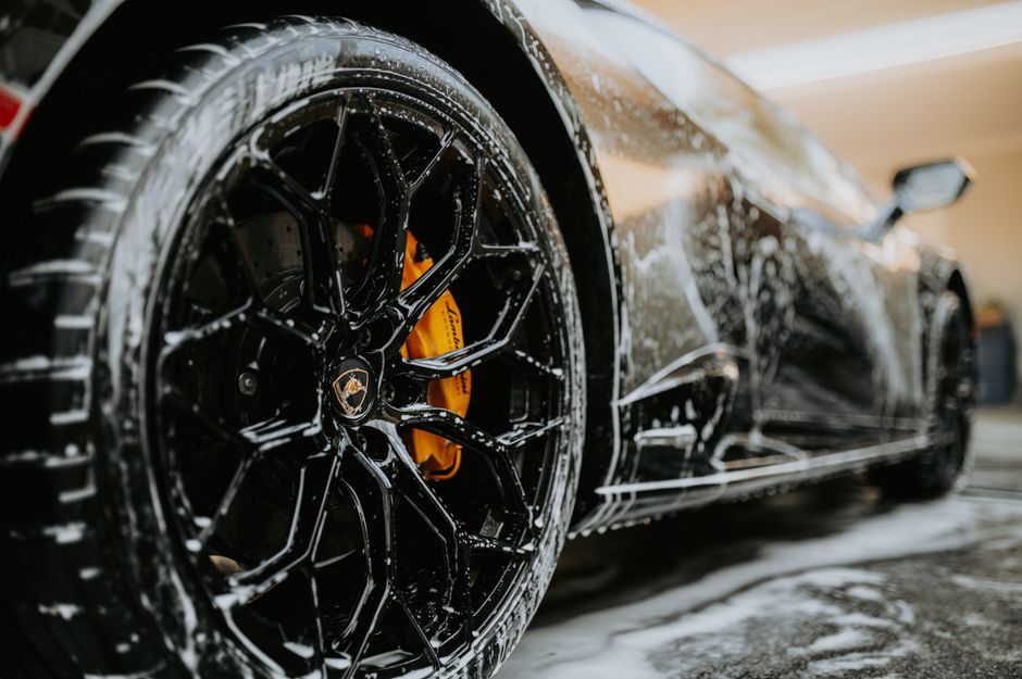 A luxurious vehicle receiving a meticulous premium hand car wash